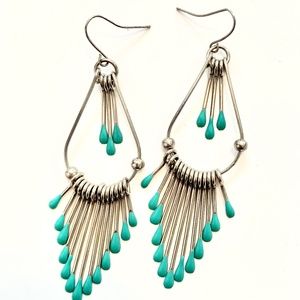 Blue drop silver toned earrings.